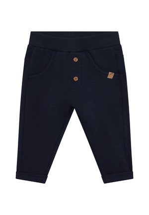 Dunkelblaue Kleinkinderhose mit geripptem Bund, zwei vorderen Knöpfen, Fronttaschen, umgeschlagenen Bündchen und kleinem braunem Logopatch auf der linken Tasche.