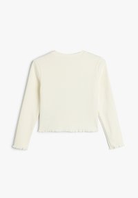 Pitkähihainen, lyhyt toppi off-white ribbed-kankaasta, jossa on pyöreä kaula-aukko ja kulunut helma. Varustettu tiukoilla hihoilla.