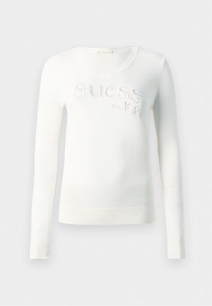 Sweater branco de malha com decote em V, mangas longas e detalhe bordado "Guess est. 1981" com acabamentos brilhantes na parte frontal.
