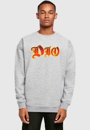 Gray sweatshirt with long sleeves, featuring a bold red and yellow "DIO" graphic. Soft texture and ribbed cuffs and hem.