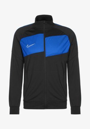 Chaqueta de entrenamiento Nike en negro con paneles de malla azules, cierre de cremallera en la parte delantera, cuello alzado, bolsillos laterales y puños de canalé. Cuenta con el logotipo de la marca en el pecho.