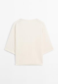 Cream-colored, short-sleeve t-shirt with a relaxed fit and raglan sleeves. Made from soft fabric with a smooth texture.