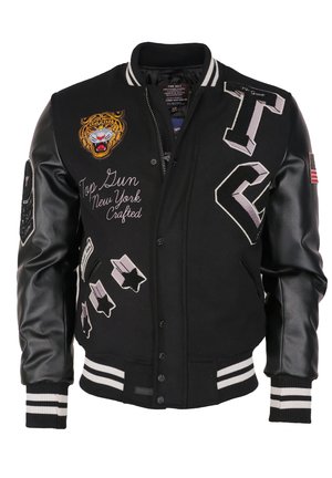 Veste universitaire noire avec manches en cuir, patch tête de tigre, texte "Top Gun New York Crafted", patchs étoiles, et poignets et col rayés.