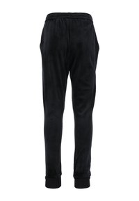 Zwarte joggingsbroek van zachte stof, met een relaxte pasvorm, elastische tailleband en omgeslagen enkels. Geen duidelijke patronen of hardware.