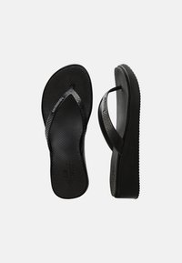 Black wedge flip-flops with textured footbeds and branded straps, shown from top and side views on a white background.