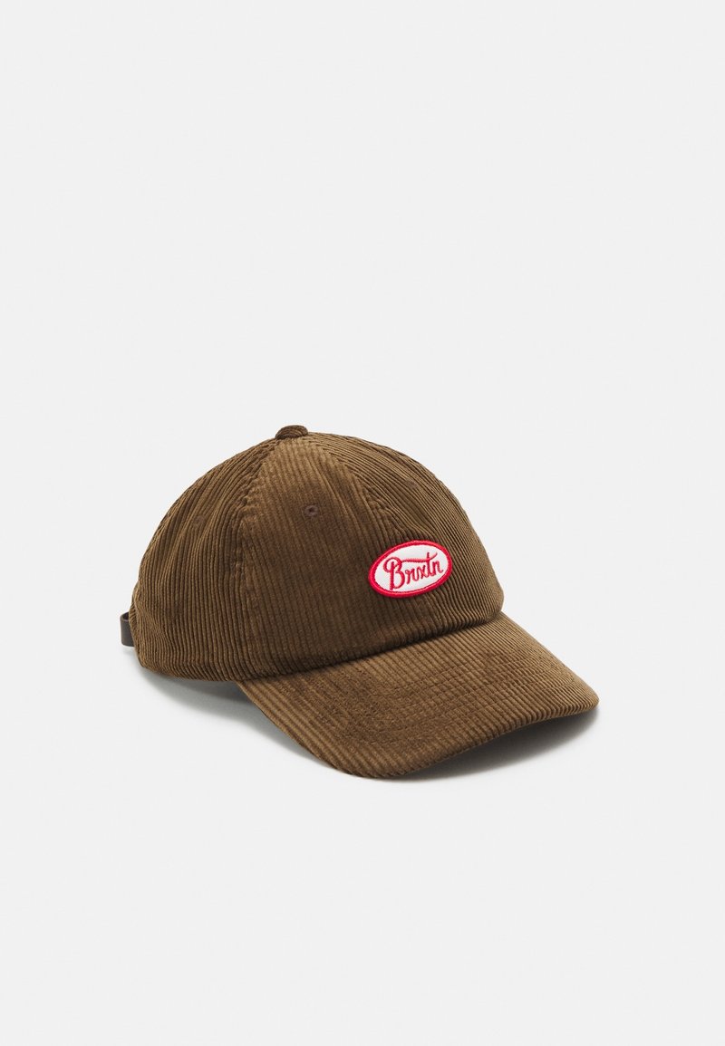 Casquette de baseball en velours côtelé marron avec une visière incurvée et un logo ovale rouge et blanc à l'avant.