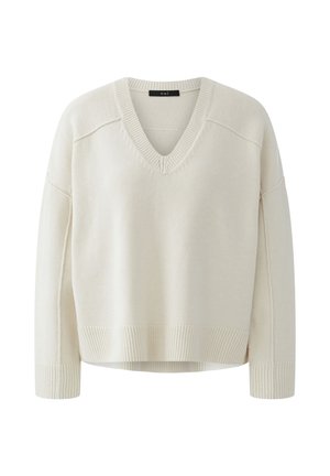 Cream-colored V-neck long-sleeve knit sweater with ribbed cuffs, hem, and neckline, featuring a loose, relaxed fit.