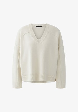 Cream-colored V-neck long-sleeve knit sweater with ribbed cuffs, hem, and neckline, featuring a loose, relaxed fit.