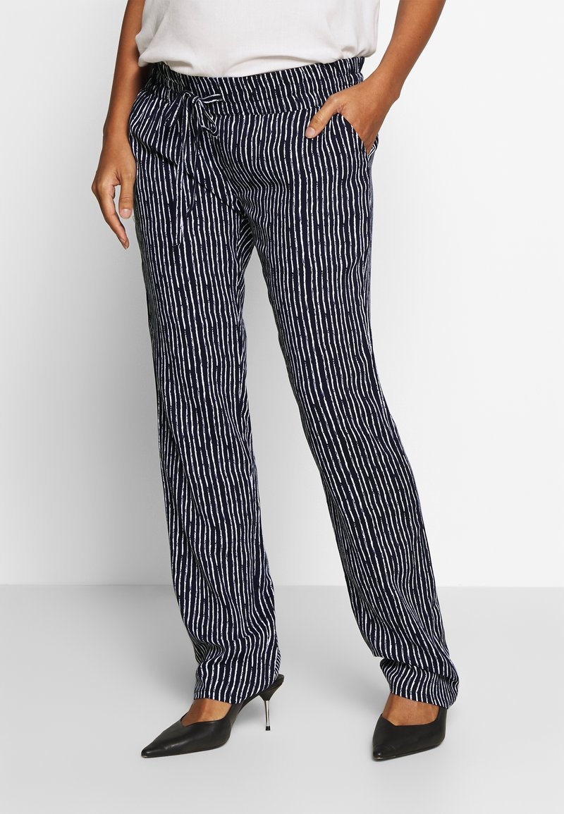 Navy patterned pants with vertical white stripes, featuring a drawstring waist and side pockets. Made from lightweight fabric.