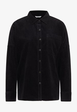 Mustast korduroost särk, millel on nööbitav esikülg, terav krae, rinnatasku ja varrukate mansetid. Vertikaalne sooniline tekstuur lisab sügavust.