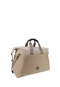 Sac de voyage beige au design structuré, avec une fermeture éclair sur le dessus, des poignées de transport doubles et une bandoulière réglable. Logo à l'avant.