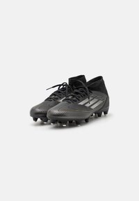 adidas Performance F50 LEAGUE MID SG - Botas de fútbol para terrenos blandos - core black/iron metallic/gold metallic