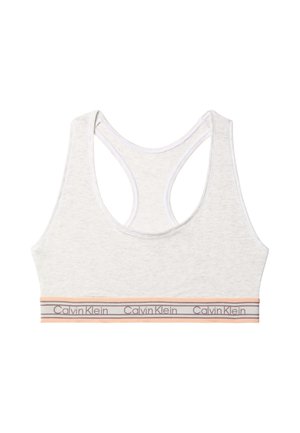 Light grey racerback sports bra with peach and grey elastic band featuring repeated Calvin Klein logo.