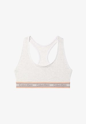 Brassière de sport racerback gris clair avec bande élastique pêche et grise ornée du logo Calvin Klein répété.