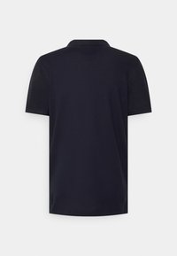 Navy blue polo shirt made of cotton, featuring short sleeves, a textured fabric, and a classic collar design with no visible logos or patterns.