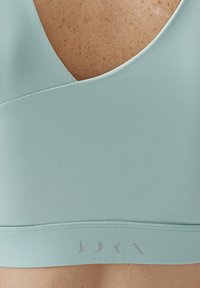 Born Living Yoga Urheiluliivit: keskitason tuki - azul claro