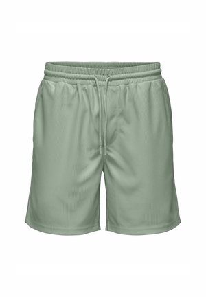 Gaiši zaļi šorti ar elastīgu jostu, aukliņas aizdari un vertikāli ribotu tekstūru, ar vidus kāju garumu.