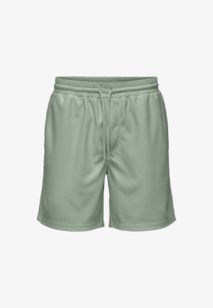 Gaiši zaļi šorti ar elastīgu jostu, aukliņas aizdari un vertikāli ribotu tekstūru, ar vidus kāju garumu.