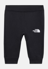 Leggings noirs extensibles avec une taille élastique, présentant un logo blanc sur la hanche gauche et un design de genou renforcé.