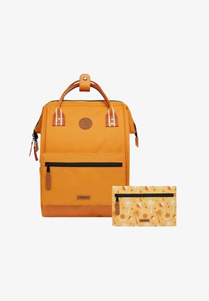 Orange fabric backpack with a front pocket and leather accents. Includes a smaller patterned pouch with a tropical print.