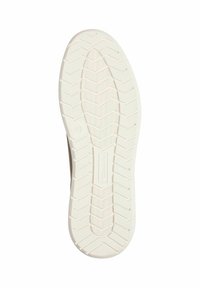 Sula på en sneaker med en strukturerad vit gummiyta och ett zick-zack mönster för grepp. Storleksmärke "42" synligt.