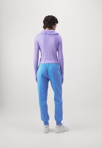 Nike Sportswear Träningsbyxor - blue