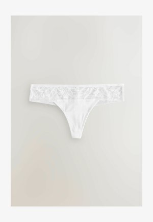 Valge tangad suure laia pitsilise vöökohaga, millel on lillemustrid, ja sile, ühtlane kangas kehaosale. Reguleeritav ja õmblusteta disain.