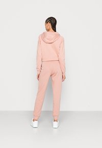 Nike Sportswear Calças de fato de treino - rose whisper/white