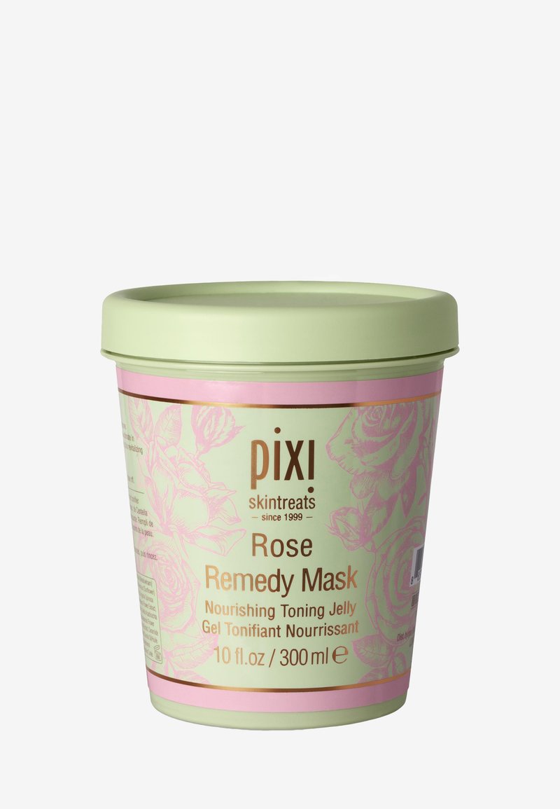 En rosa og grønn tub av Pixi Rose Remedy Mask, med blomsterdesign og gullakenter, merket som nærende toninggelé, 300 ml.