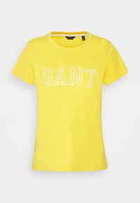Gelbes Baumwoll-T-Shirt mit kurzen Ärmeln, rundem Ausschnitt und weißem "GANT"-Text auf der Brust. Angenehme Textur, lässige Passform.