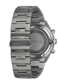 Montre en acier inoxydable avec finition brossée et polie, dotée d'un bracelet à maillons, d'un boîtier rond et d'un fond circulaire marqué "5 ATM" et "ACIER INOXYDABLE."