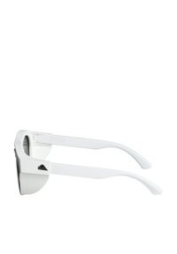 White sunglasses with a thick, angular frame, gray lenses, and textured black logo on the side. Slim white arms taper towards the tips.