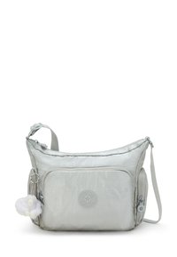 Metallic silver shoulder bag with a smooth texture, featuring a front pocket, logo patch, and a detachable charm of a white fluffy animal.
