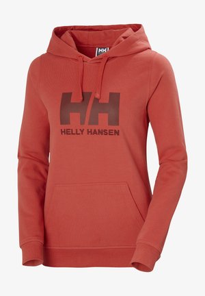Červená mikina s kapucí na stažení a přední kapsou. Na hrudi se nachází velké tmavě hnědé logo "HH" a nápis "Helly Hansen". Vyrobena z měkkého materiálu.