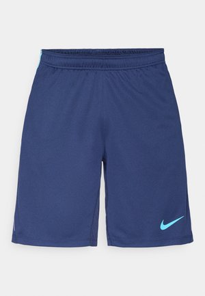 Marineblå atletikshorts lavet af åndbart stof, med elastisk taljebånd og en lyseblå Nike-logo detalje på nederste højre side.