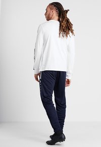 JAKO ACTIVE - Trainingsbroek - navy/white