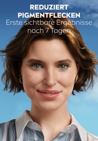 Beauty product advertisement featuring a woman with medium brown, wavy hair and a light blue shirt with vertical stripes, displaying smooth skin.