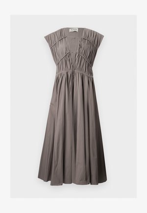 Taupe sleeveless dress with deep V-neck, gathered bodice, flowing skirt, and tie closures at neckline and waist.