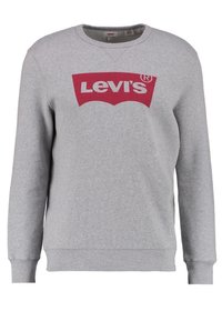 Sweatshirt gris en mélange de coton, avec un grand logo Levi's rouge sur le devant. Poignets et ourlet côtelés, encolure ronde.