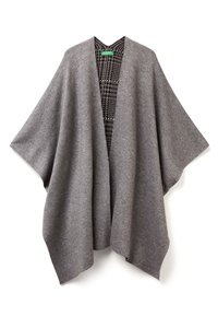 Šedý vlněný pončo s širokými rukávy a otevřeným předním dílem. Na vnitřní straně je viditelný černobílý vzor houndstooth. Měkká textura.