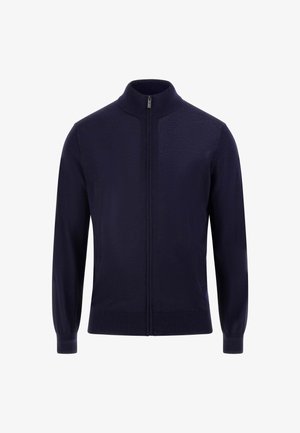 Marineblauwe rits-trui van een zachte, gestructureerde stof met een hoge kraag en geribde manchetten, met een minimalistisch ontwerp zonder patronen.