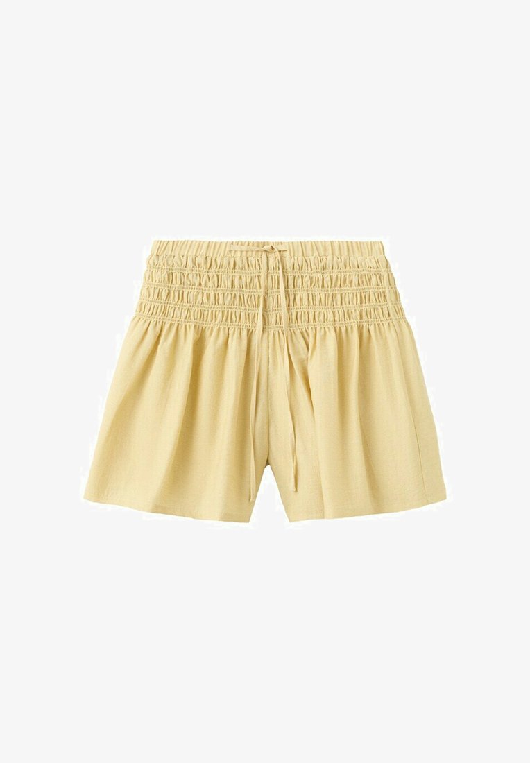 Shorts amples beige clair avec taille élastique froncée et cordon de serrage, confectionnés dans un tissu doux et léger.