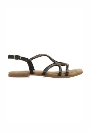 Sandalias planas negras con un diseño de tiras y adornos de cuentas decorativos. La suela es beige y tiene una textura acolchada para mayor comodidad.