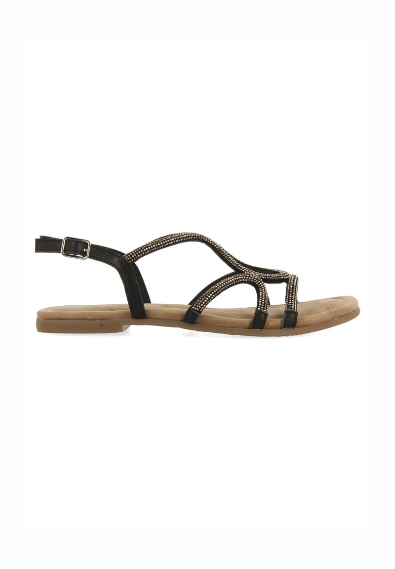 Sandalias planas negras con un diseño de tiras y adornos de cuentas decorativos. La suela es beige y tiene una textura acolchada para mayor comodidad.