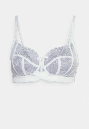 Soutien-gorge en dentelle gris clair avec un délicat nœud, des bretelles réglables et une bordure en dentelle festonnée sur les bords. Conception semi-transparente.