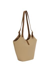 Beige kassi, jossa on teksturoitu pinta, ruskeat nahkahihnat ja minimalistischinen muotoilu, jossa on avoin yläosa ja säädettävät yksityiskohdat.