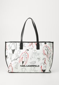 Tote bag made from canvas featuring black handles, white background, and fashion sketches in black and red, with "KARL LAGERFELD" logo.