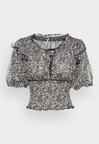 Top floral transparente em preto e branco com mangas curtas bufantes, cintura franzida e detalhe de cordão no decote. Tecido texturizado com babados.