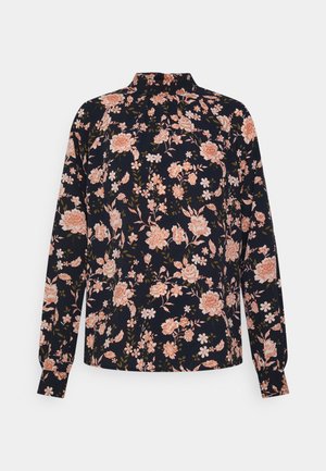 Camisa de mangas longas com padrão floral em azul-marinho, com flores rosas e brancas, apresentando um colarinho alto e punhos elásticos. Tecido macio.