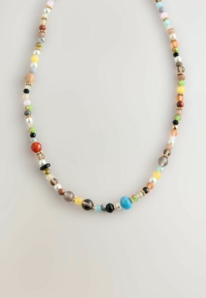 Beaded necklace featuring an array of colored stones, including turquoise, pearls, and facets, separated by gold-toned accents.